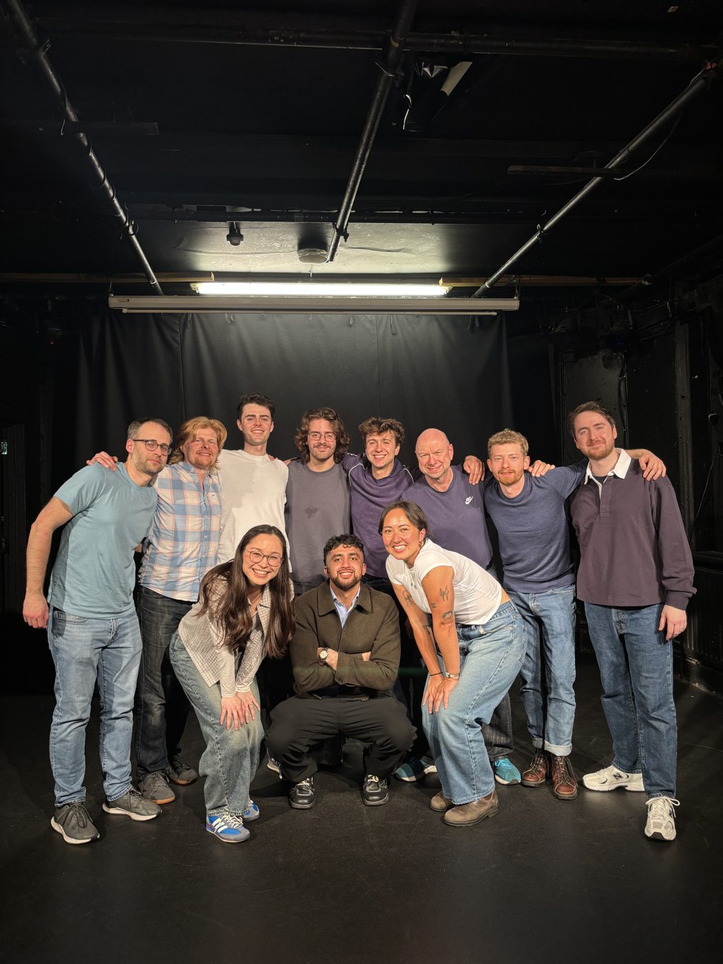 The troupe together on stage after a show